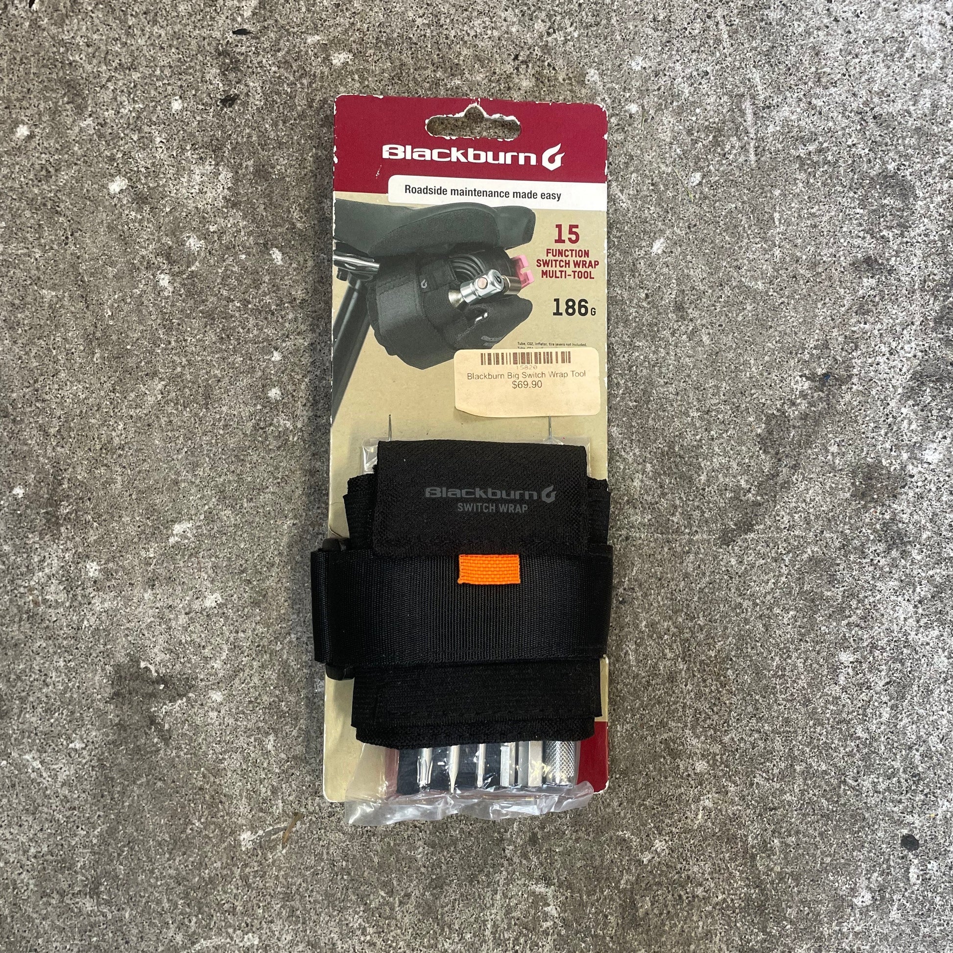 Black belt with packaging on a gray concrete surface