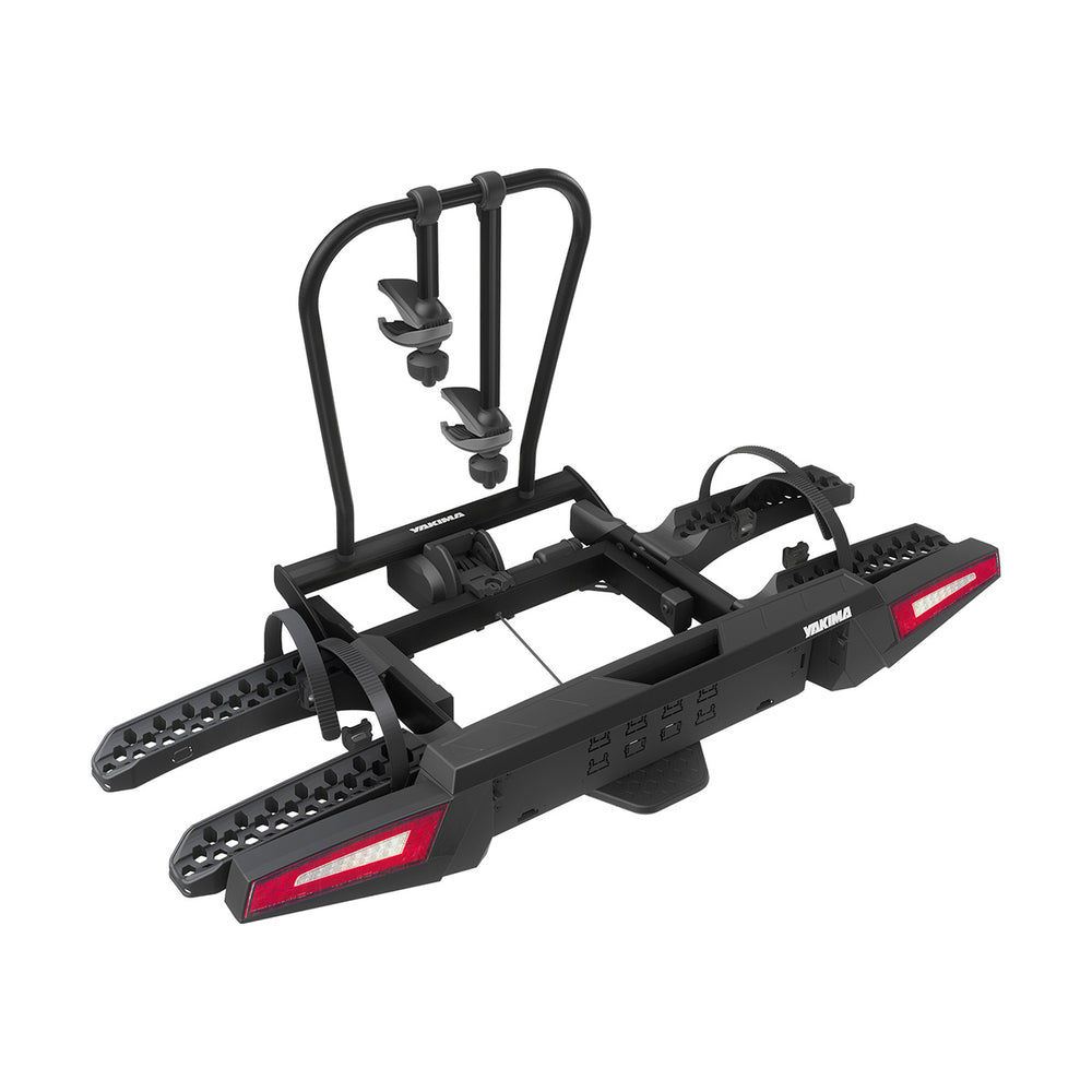 Black bike rack with red reflectors on a white background